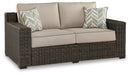 Coastline Bay Outdoor Loveseat with Cushion - Jack’s Furniture and More (Laredo, TX)