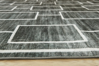 Elderland Washable 7'6" x 9'6" Area Rug - Jack’s Furniture and More (Laredo, TX)