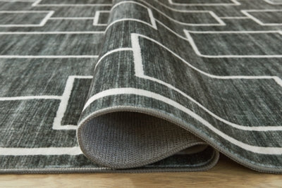 Elderland Washable 7'6" x 9'6" Area Rug - Jack’s Furniture and More (Laredo, TX)