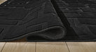 Gibbswell Washable 5' x 7' Area Rug - Jack’s Furniture and More (Laredo, TX)
